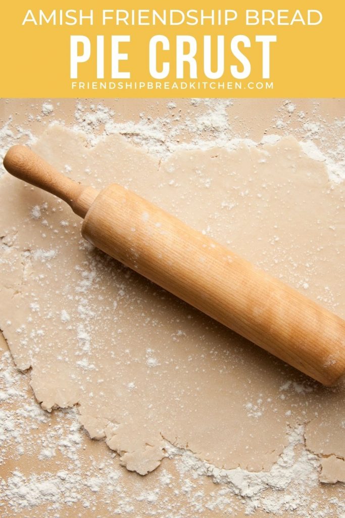 unbaked pie crust with rolling pin on top of dough