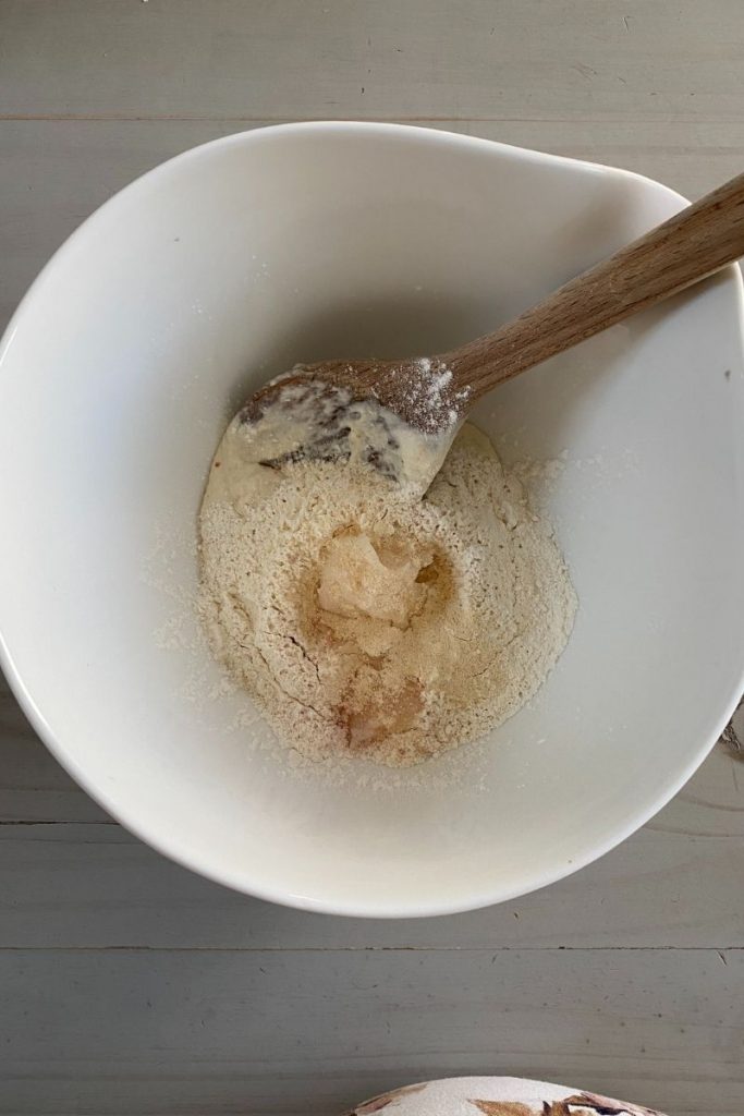 Mixing bowl with flour and starter.